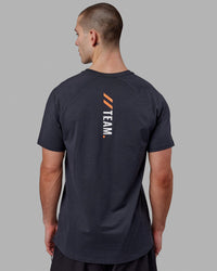 Man wearing LSKD x FS VapourFLX Trainer Tee - Black Marl