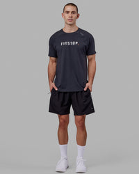 Man wearing LSKD x FS VapourFLX Trainer Tee - Black Marl