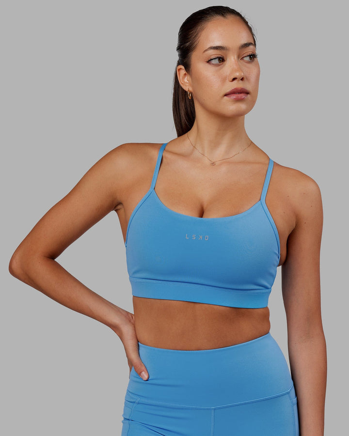 Woman wearing Lift Sports Bra - Azure Blue