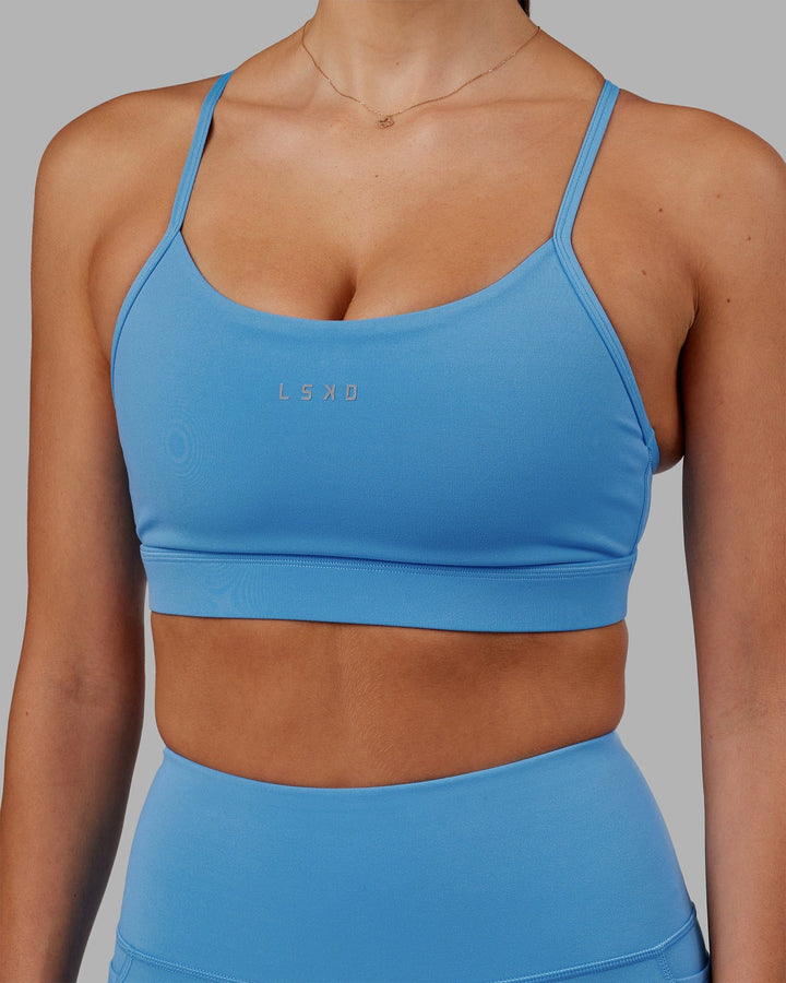 Woman wearing Lift Sports Bra - Azure Blue