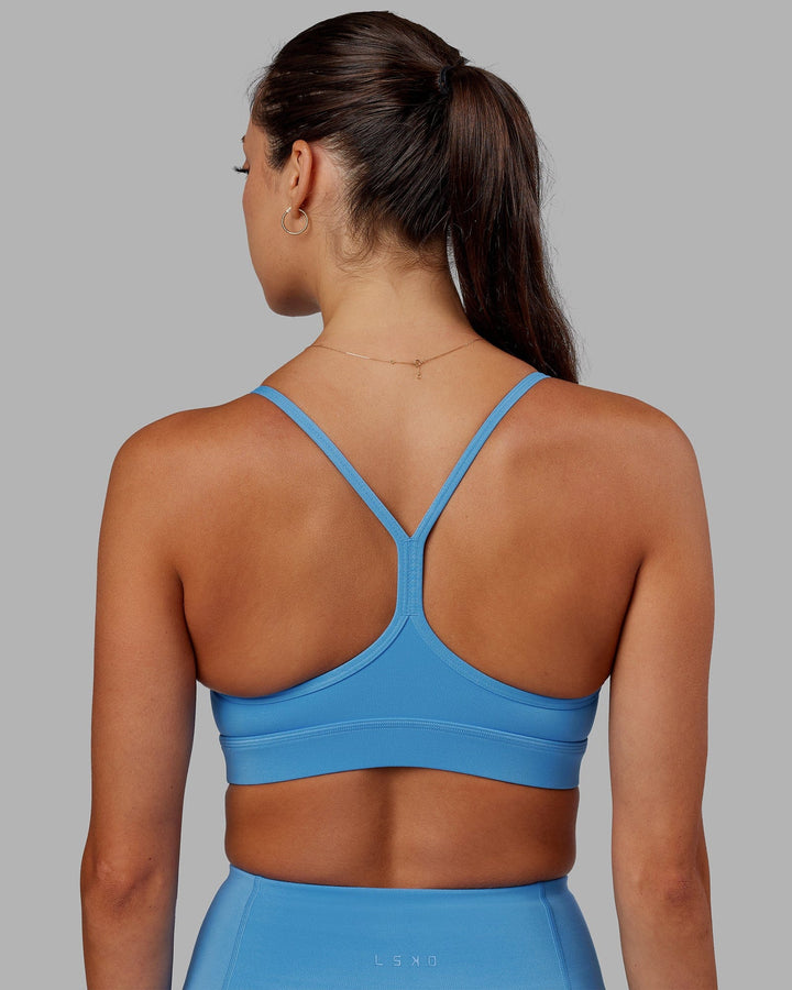 Woman wearing Lift Sports Bra - Azure Blue