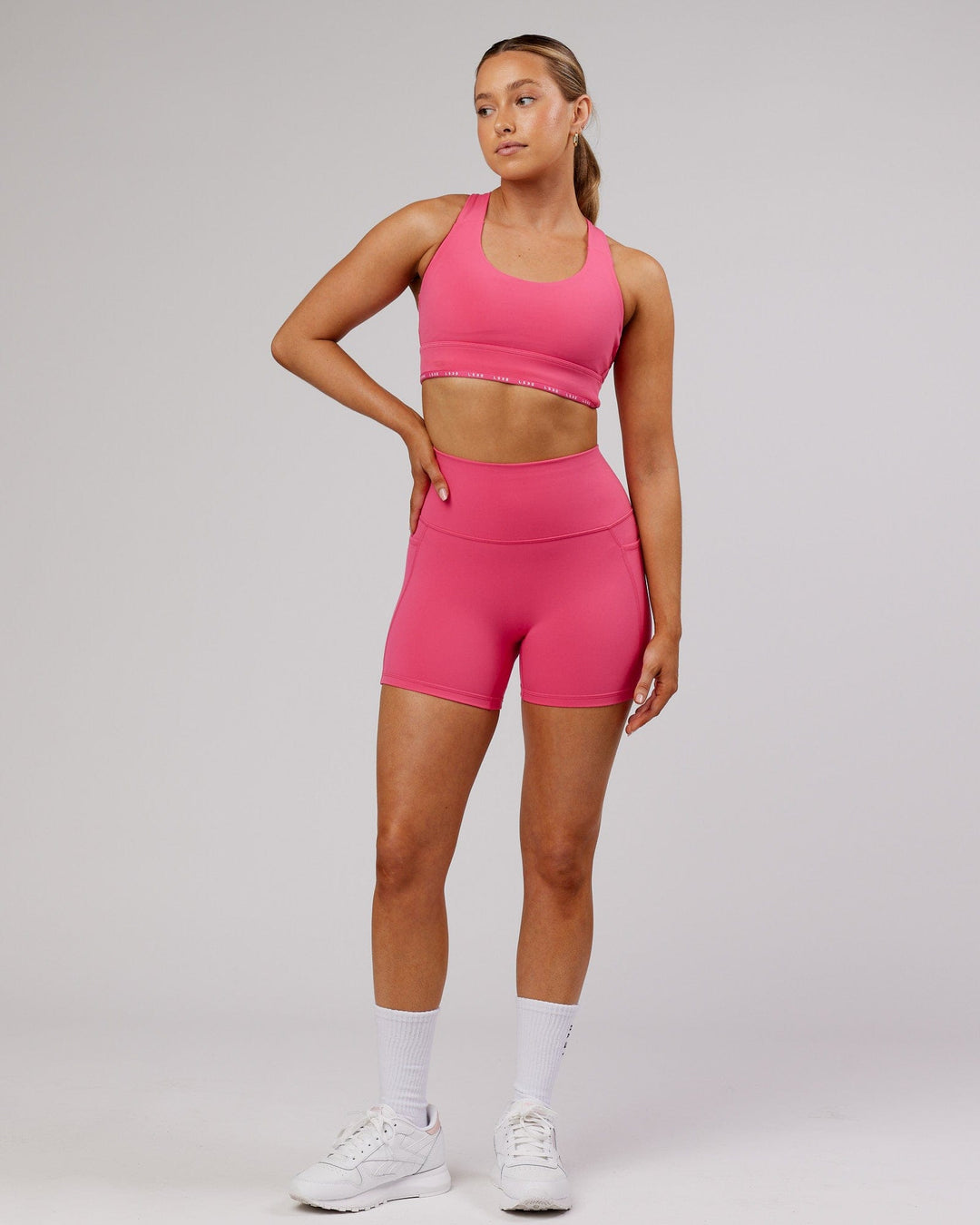Woman wearing MVP Sports Bra - Flamingo