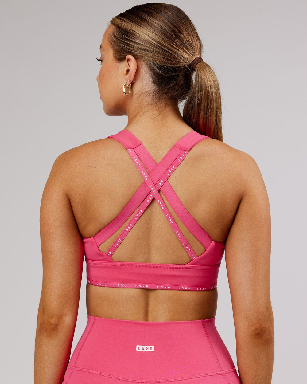 Woman wearing MVP Sports Bra - Flamingo