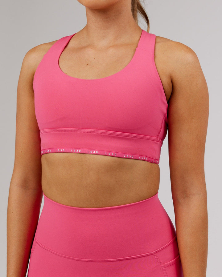 Woman wearing MVP Sports Bra - Flamingo