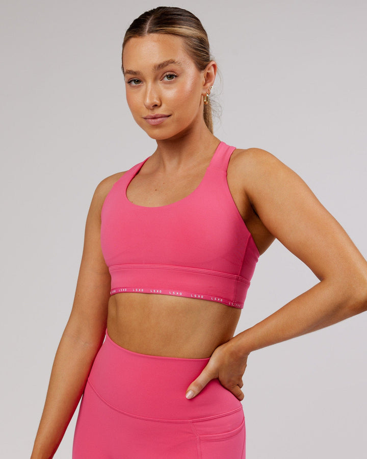Woman wearing MVP Sports Bra - Flamingo