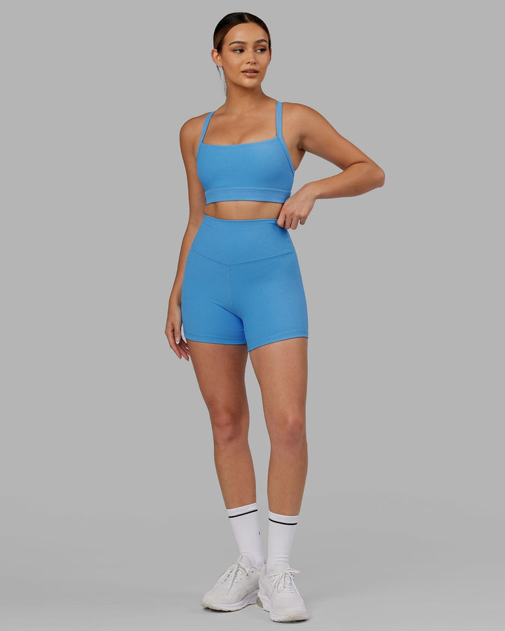 Woman wearing Momentum Ribbed Sports Bra - Azure Blue