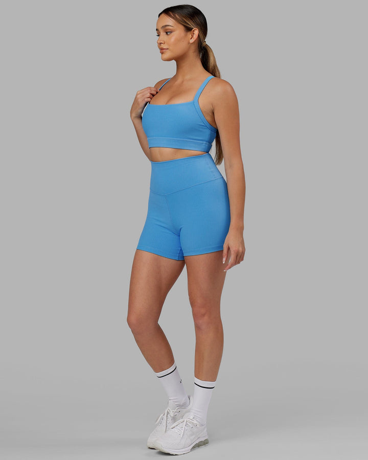 Woman wearing Momentum Ribbed Sports Bra - Azure Blue
