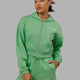 Woman wearing Motion Cropped Hoodie - Apple Mint