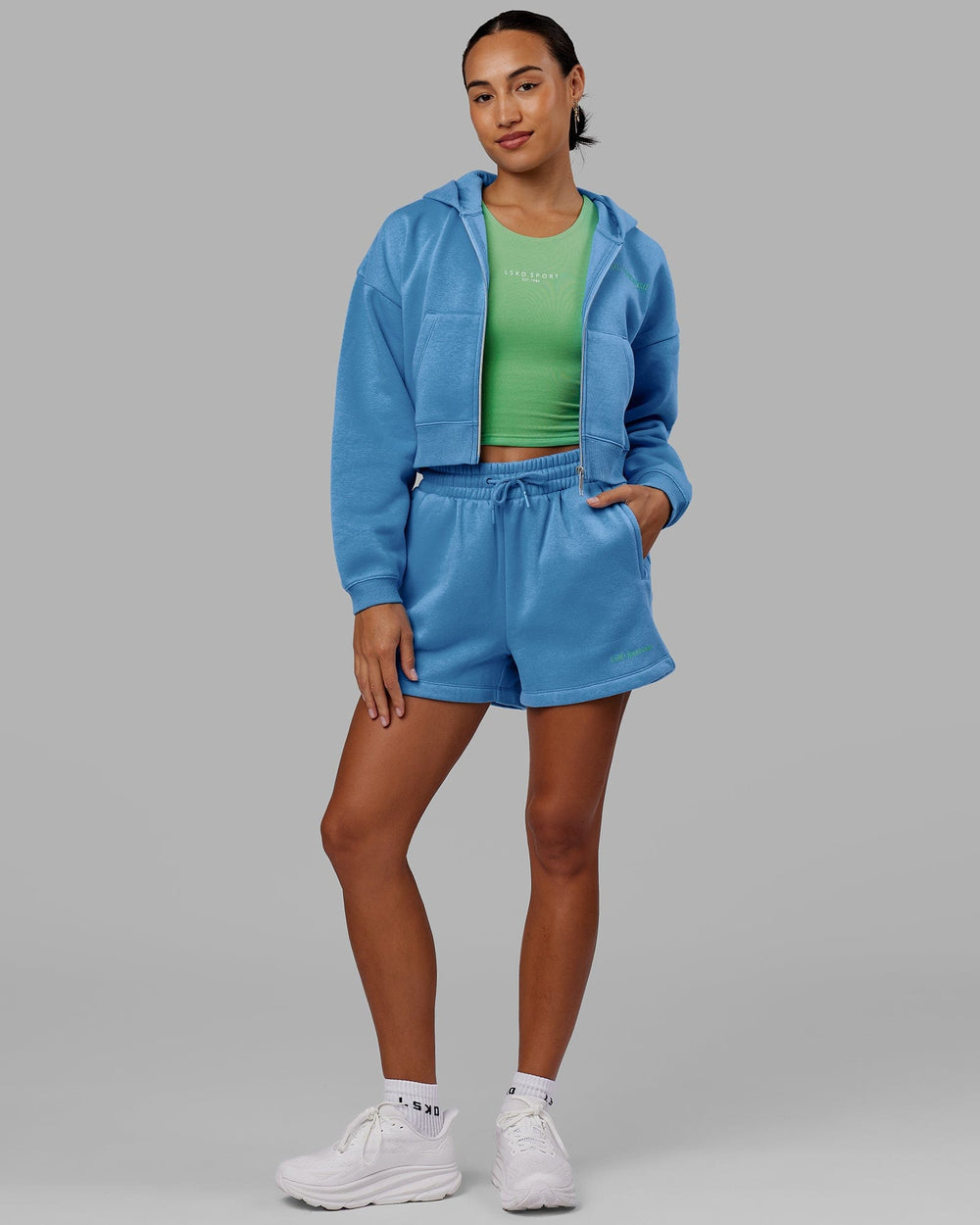 Woman wearing Motion Cropped Hoodie - Azure Blue