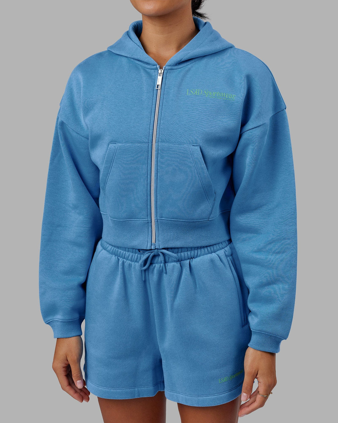 Woman wearing Motion Cropped Hoodie - Azure Blue