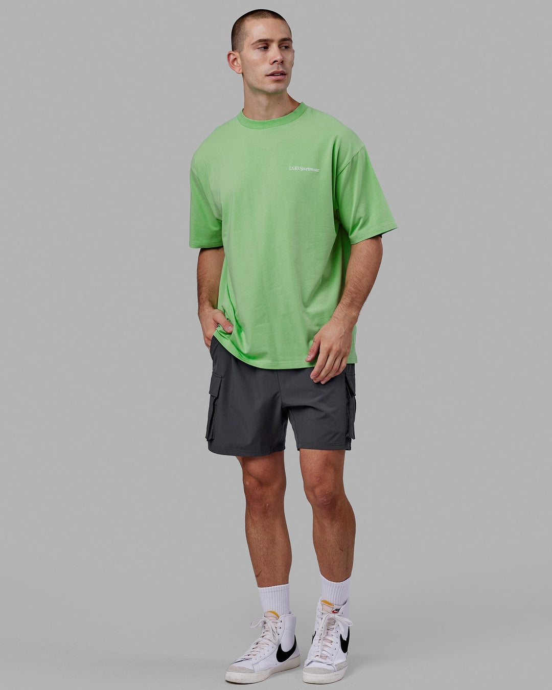 Man wearing Unisex Motion FLXCotton Tee Oversize - Apple Mint