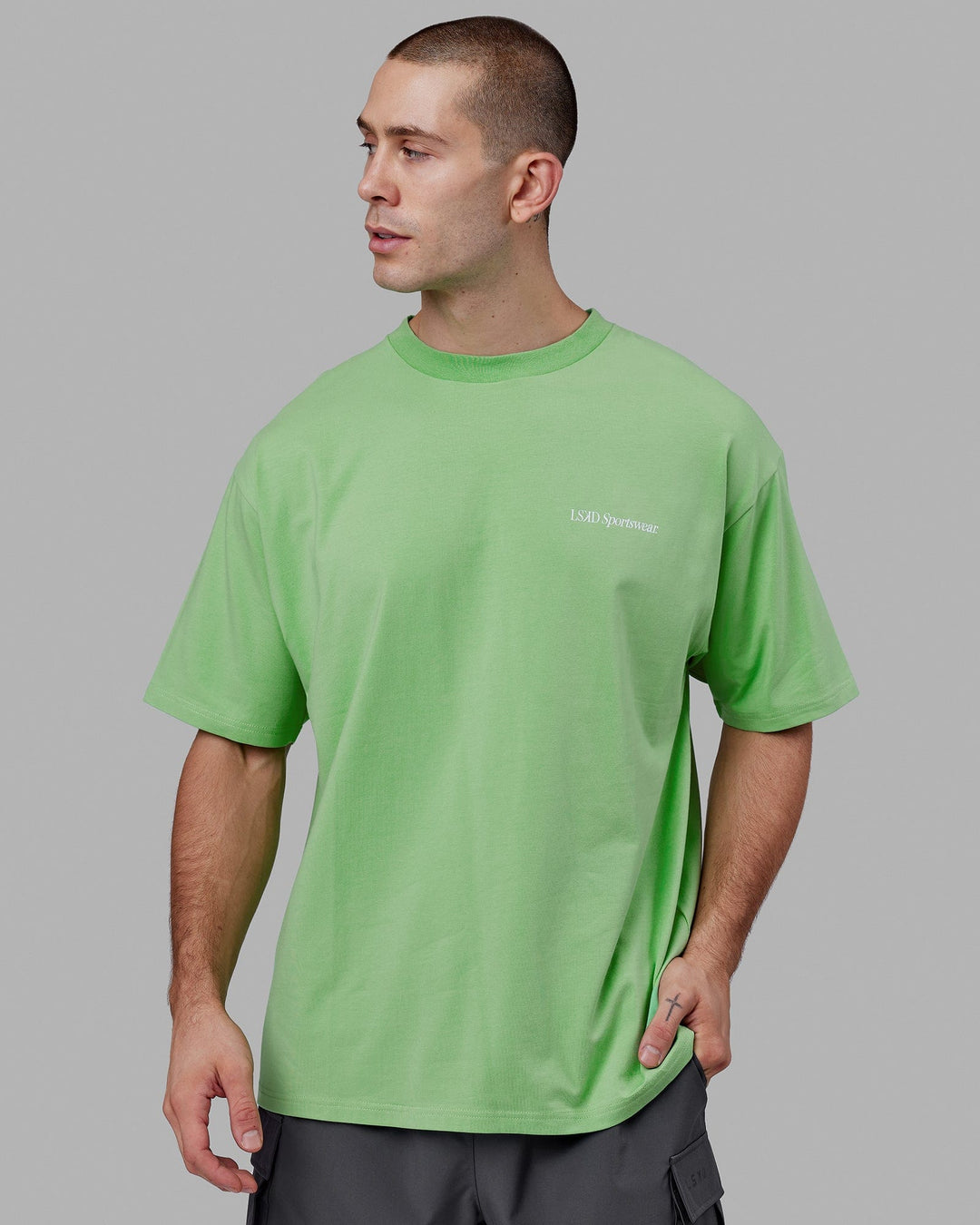Man wearing Unisex Motion FLXCotton Tee Oversize - Apple Mint