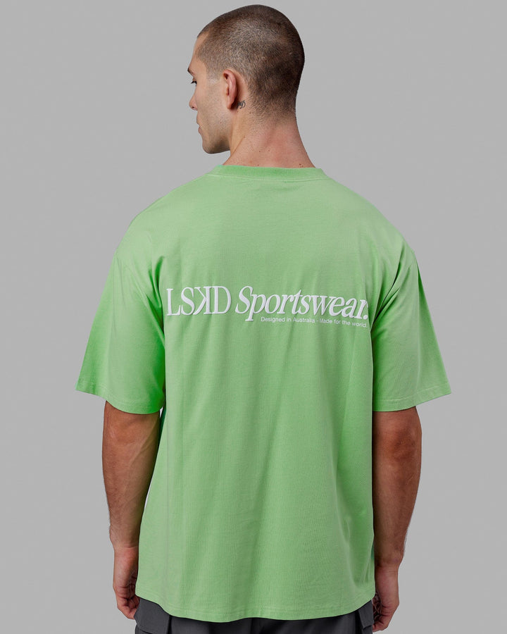 Man wearing Unisex Motion FLXCotton Tee Oversize - Apple Mint