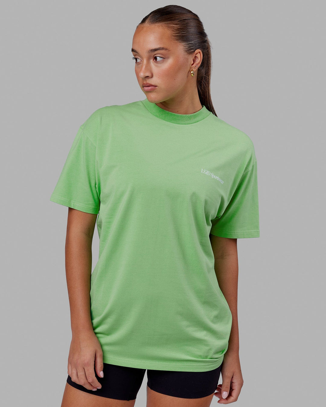 Woman wearing Unisex Motion FLXCotton Tee Oversize - Apple Mint