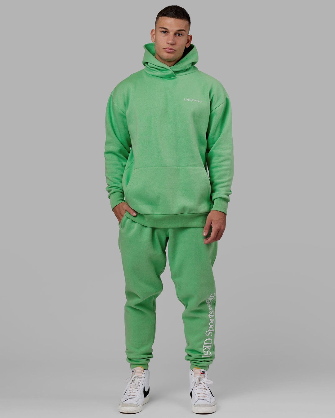 Man wearing Unisex Motion Hoodie Oversize - Apple Mint