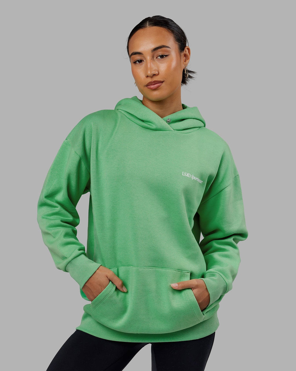 Woman wearing Unisex Motion Hoodie Oversize - Apple Mint