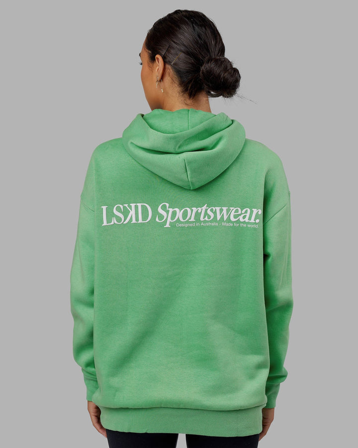 Woman wearing Unisex Motion Hoodie Oversize - Apple Mint