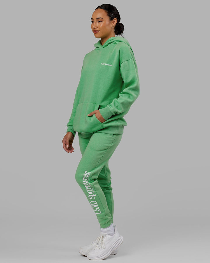 Woman wearing Unisex Motion Hoodie Oversize - Apple Mint