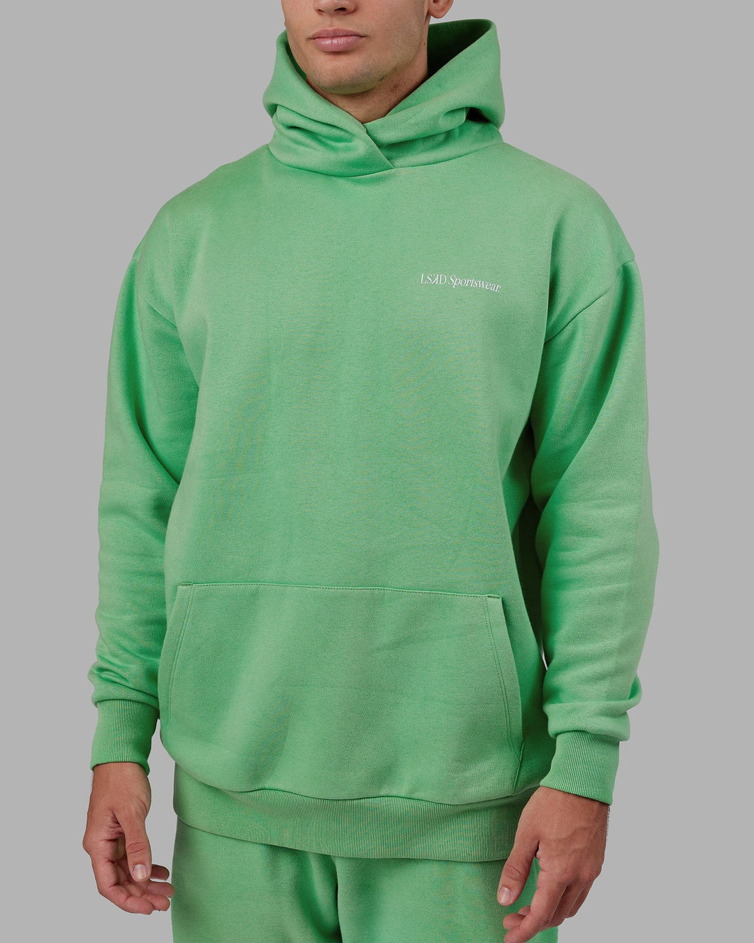 Man wearing Unisex Motion Hoodie Oversize - Apple Mint