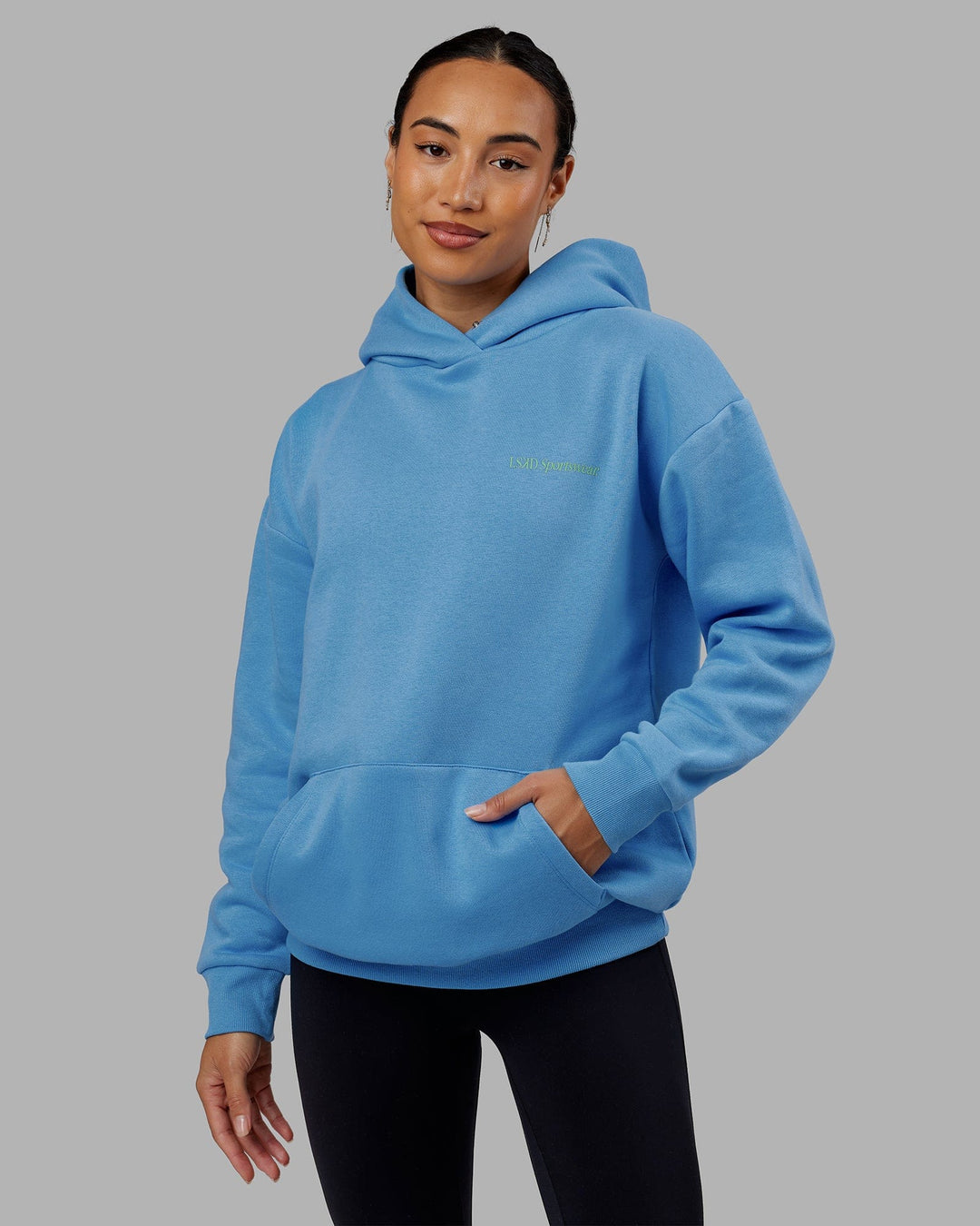 Woman wearing Unisex Motion Hoodie Oversize - Azure Blue