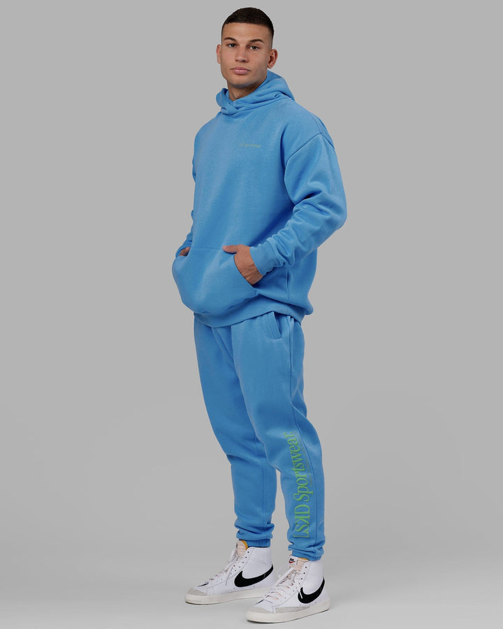 Man wearing Unisex Motion Hoodie Oversize - Azure Blue