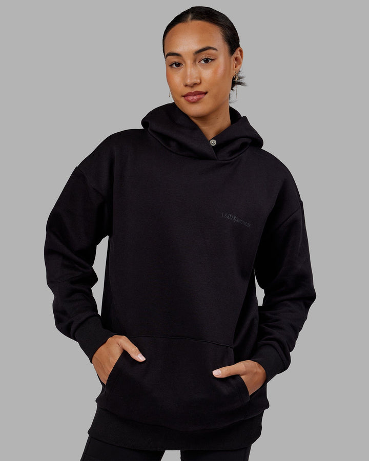 Woman wearing Unisex Motion Hoodie Oversize - Black-Black