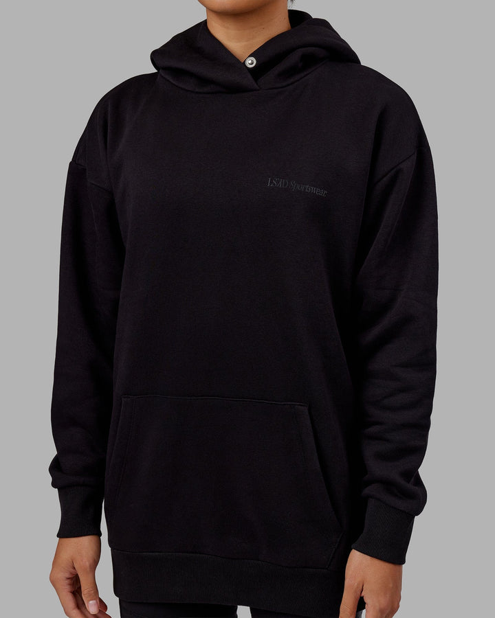 Woman wearing Unisex Motion Hoodie Oversize - Black-Black