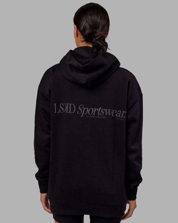 Woman wearing Unisex Motion Hoodie Oversize - Black-Black