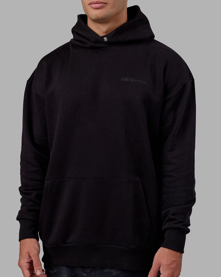 Man wearing Unisex Motion Hoodie Oversize - Black-Black