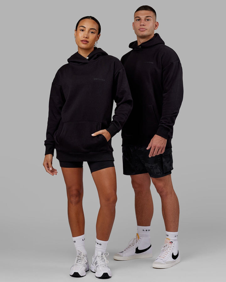 Man and Woman wearing Unisex Motion Hoodie Oversize - Black-Black