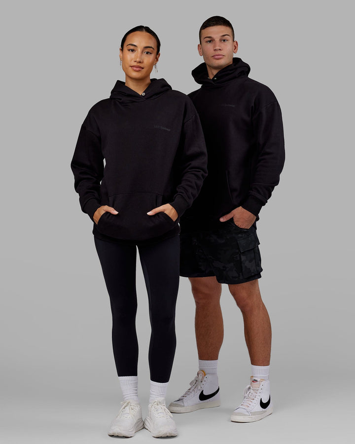 Man and Woman wearing Unisex Motion Hoodie Oversize - Black-Black