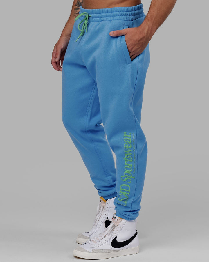 Man wearing Unisex Motion Trackpant - Azure Blue