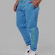 Man wearing Unisex Motion Trackpant - Azure Blue