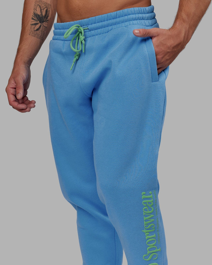 Man wearing Unisex Motion Trackpant - Azure Blue