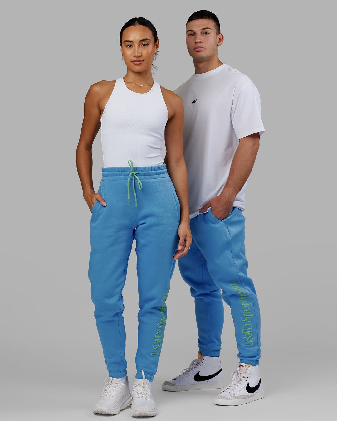 Man and Woman wearing Unisex Motion Trackpant - Azure Blue