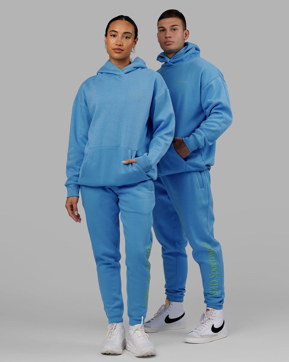 Man and Woman wearing Unisex Motion Trackpant - Azure Blue