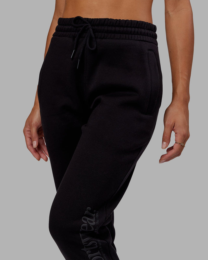Woman wearing Unisex Motion Trackpant - Black-Black