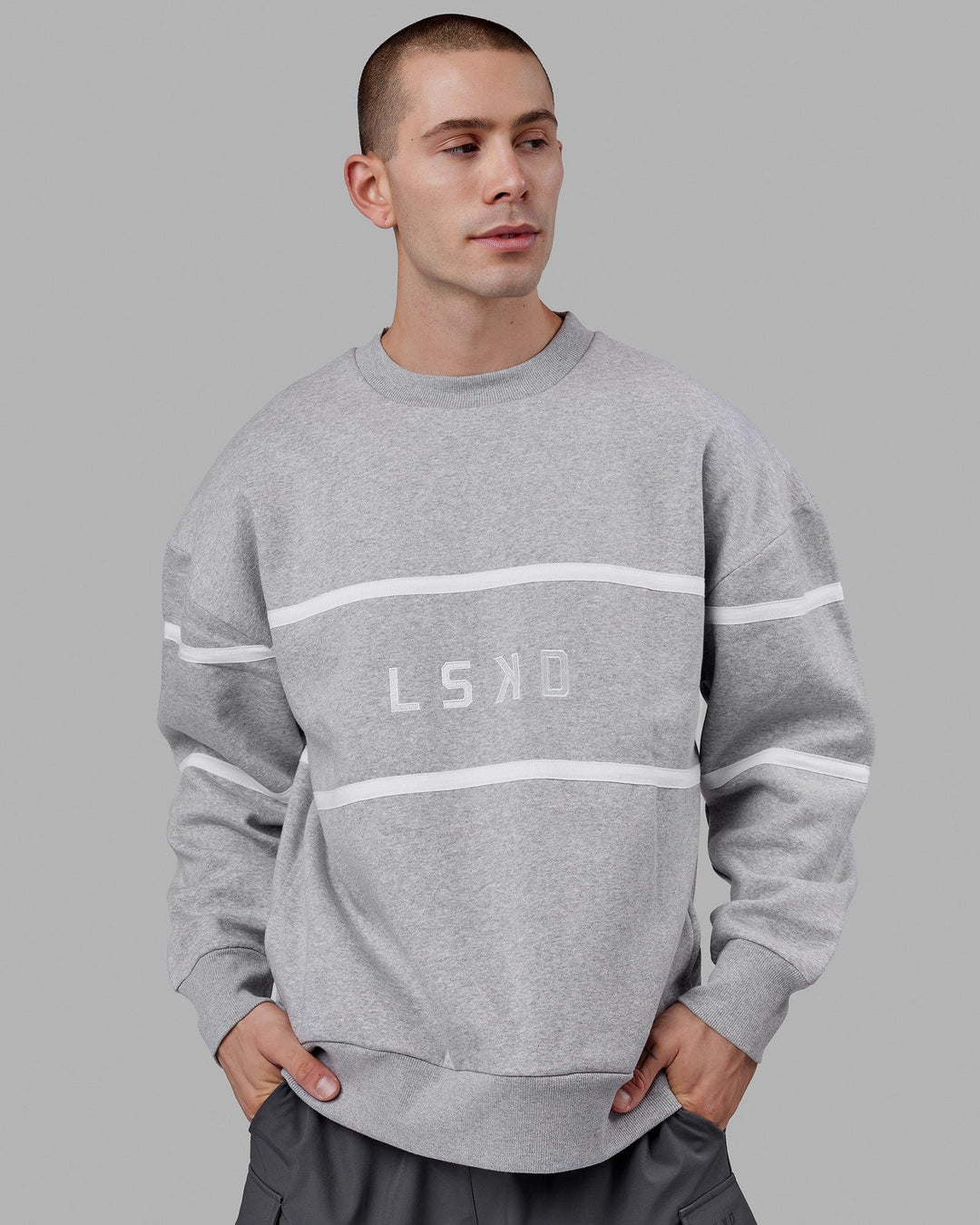 Man wearing Unisex Parallel Sweater Oversize - Lt Grey Marl