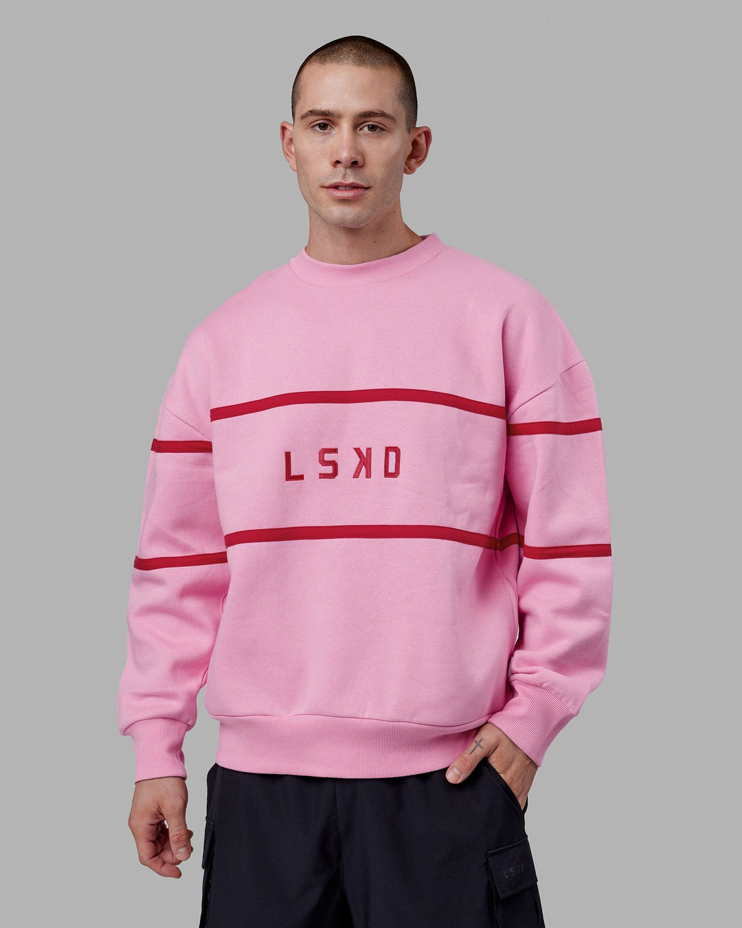 Man wearing Unisex Parallel Sweater Oversize - Pink Frosting