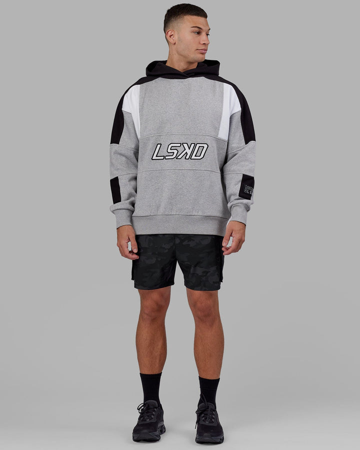 Man wearing Unisex Slam Hoodie Oversize - Lt Grey Marl-Black