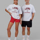 Man and Woman wearing Unisex Sports Dept. Tee Oversize - White-Red