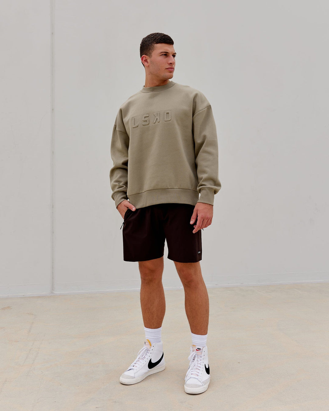 Man wearing Unisex Stamped Sweater Oversize - Laurel Oak