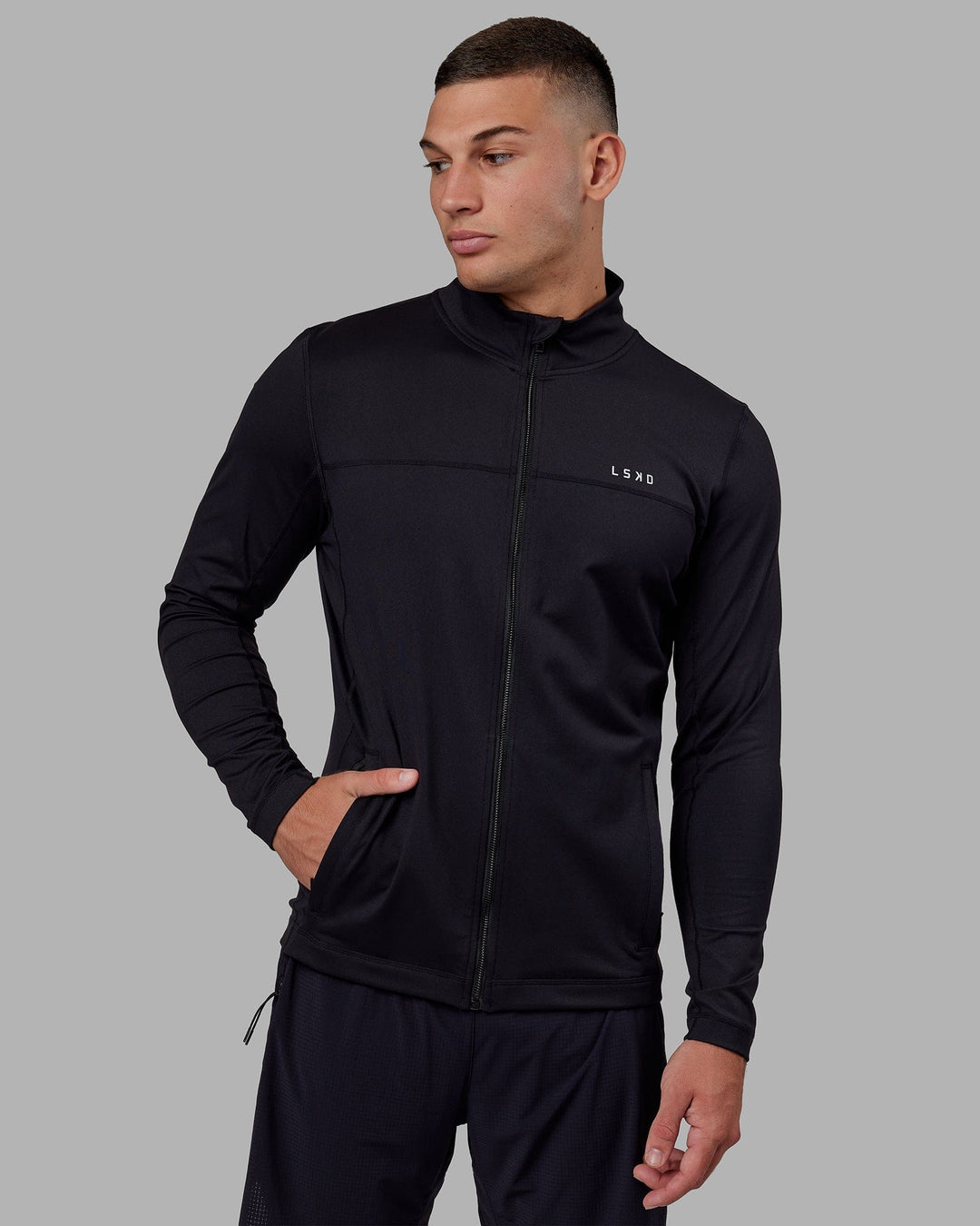 Man wearing Stride Zip Through Performance Jacket - Black