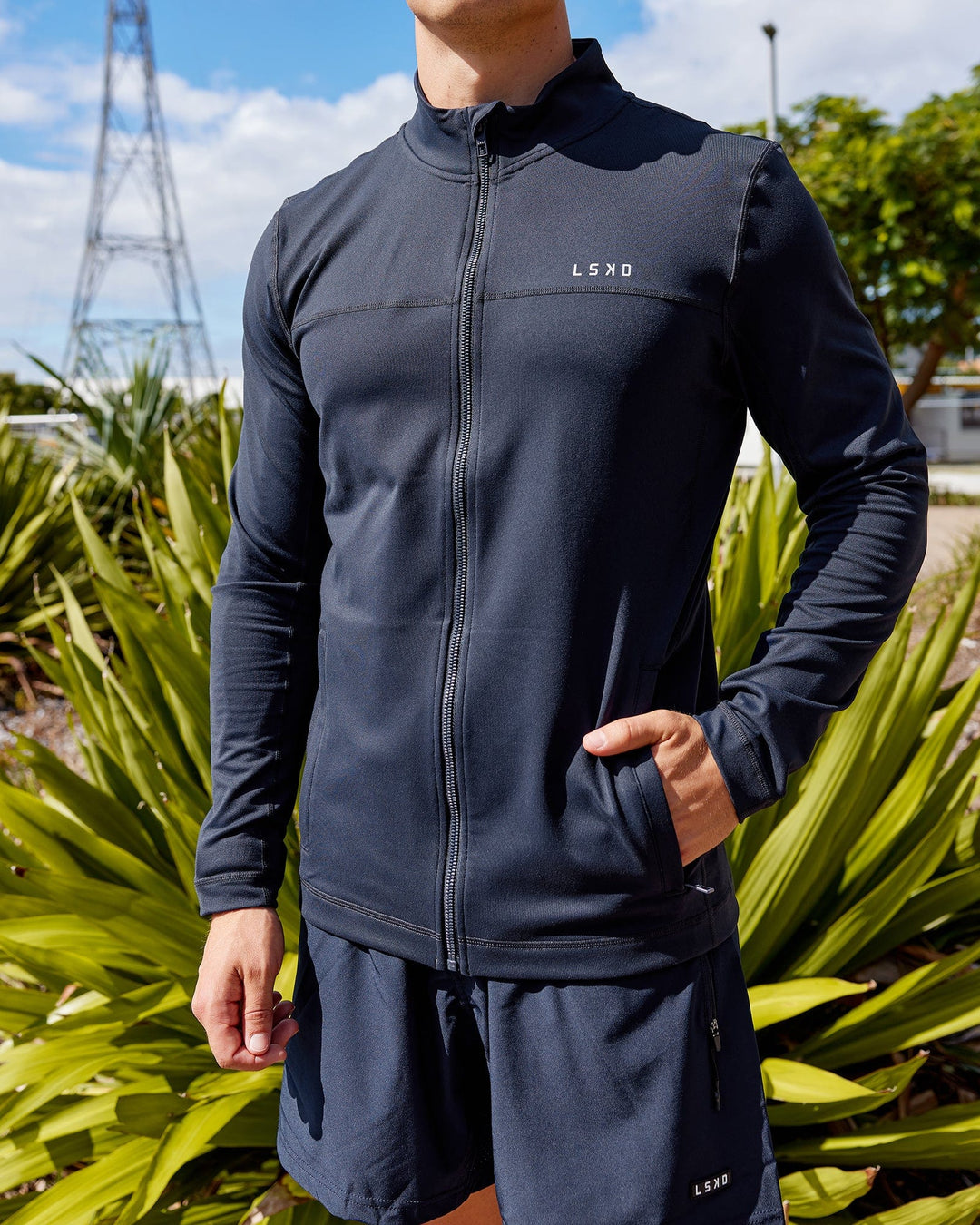 Man wearing Stride Zip Through Performance Jacket - Navy
