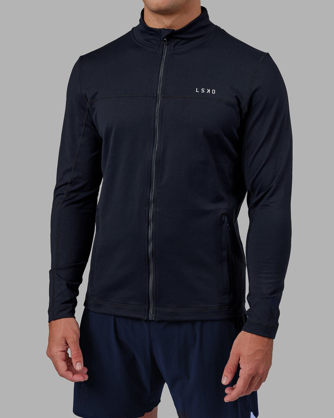 Man wearing Stride Zip Through Performance Jacket - Navy