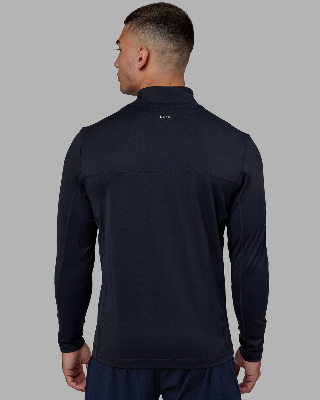 Man wearing Stride Zip Through Performance Jacket - Navy