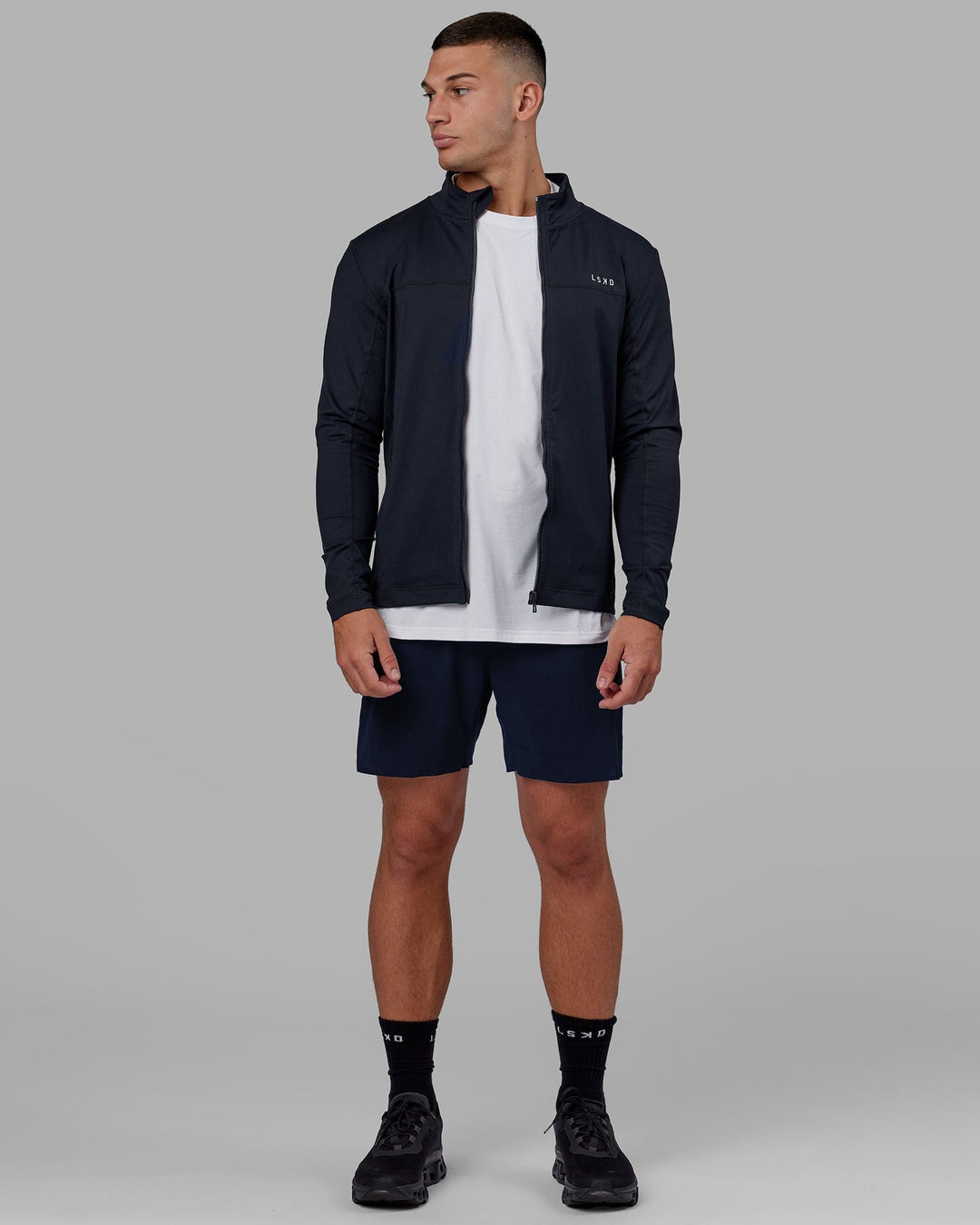 Man wearing Stride Zip Through Performance Jacket - Navy