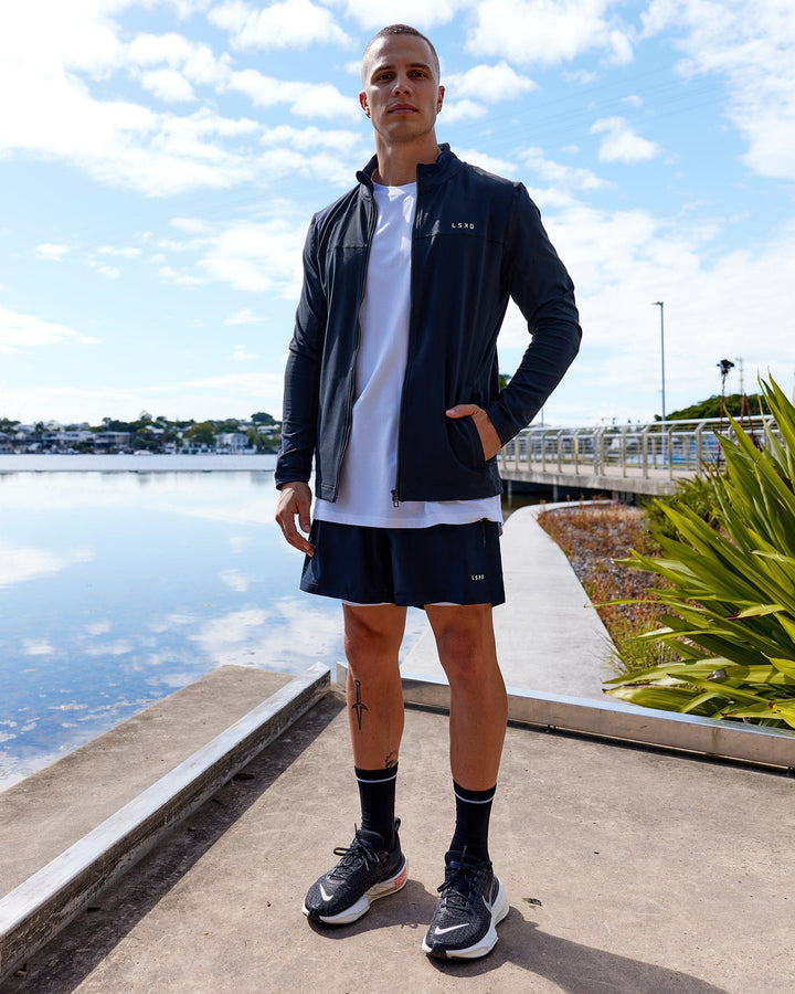 Man wearing Stride Zip Through Performance Jacket - Navy