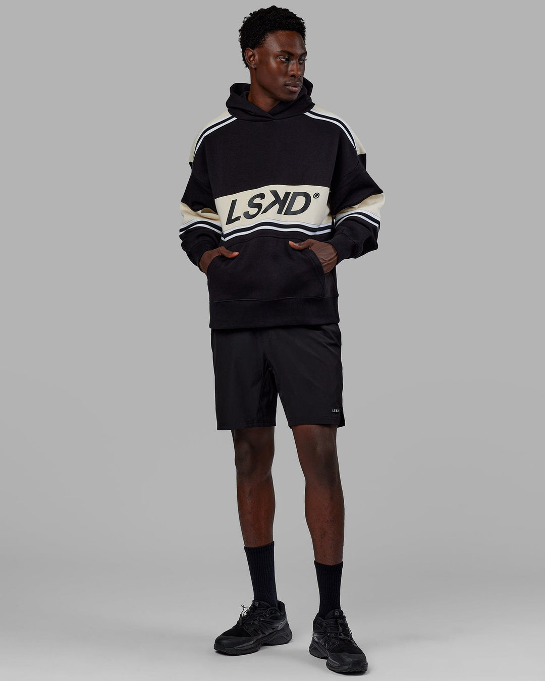Man wearing Unisex A-Team Hoodie Oversize - Black-Bone