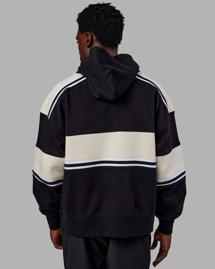 Man wearing Unisex A-Team Hoodie Oversize - Black-Bone